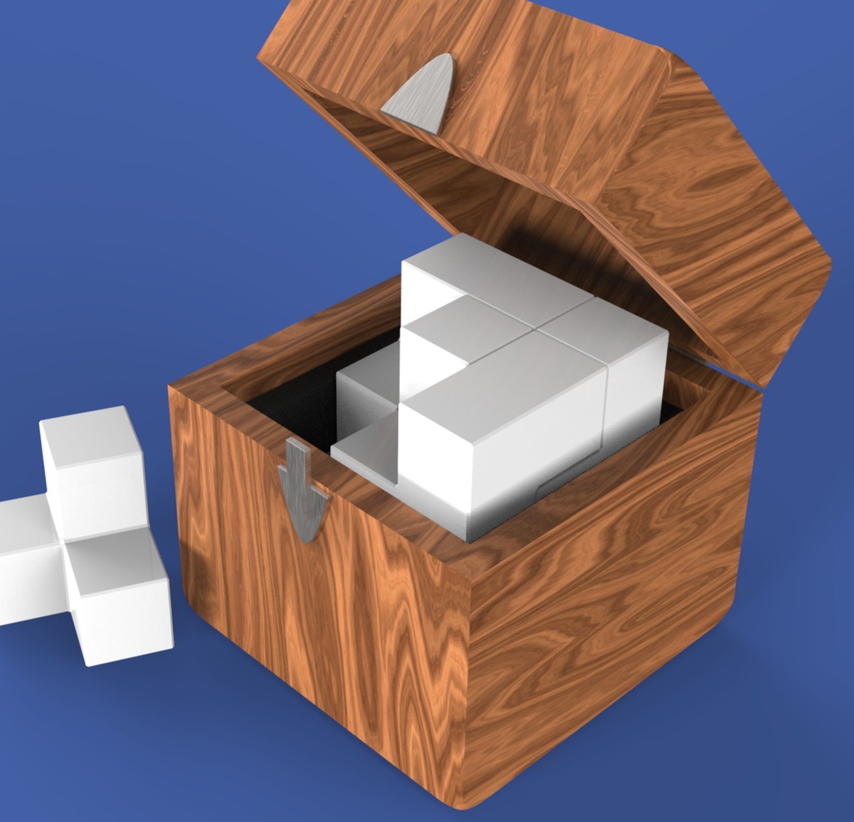 The Anchor: an open wooden box holding a set of white blocks, with a modular piece placed beside it, showing the form factor that carries the arrange-and-rearrange logic into physical space.